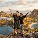 Japanese Couple at Padar Island Peak.webp